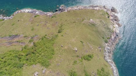 aerial view of seacoast view in phuket island.beautiful sea surface amazing waves seascape mountain view in phuket thailand.high quality footage from drone 4k