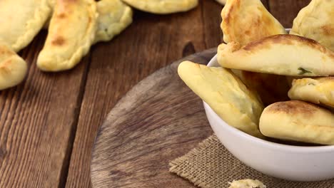 homemade empanadas on a rotating plate (seamless loopable)