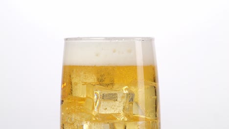 glass of beer with ice