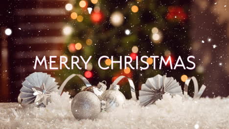 Animation-of-merry-christmas-text-over-snow-falling-with-christmas-decorations