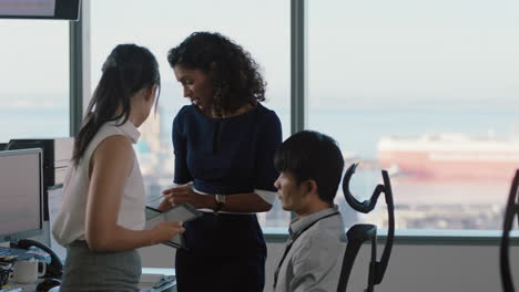 business people working team leader woman meeting with colleagues discussing project manager sharing ideas on tablet computer group of executives brainstorming in office