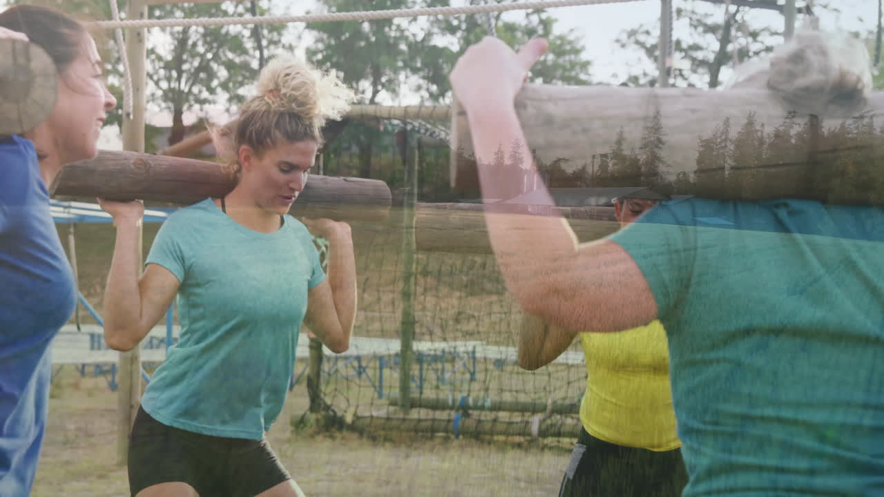 Carrying logs, women participating in outdoor team-building exercise in nature