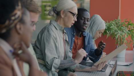 diverse team meeting in a cafe
