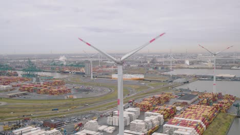 wind turbines in cargo area of port in belgium, aerial view