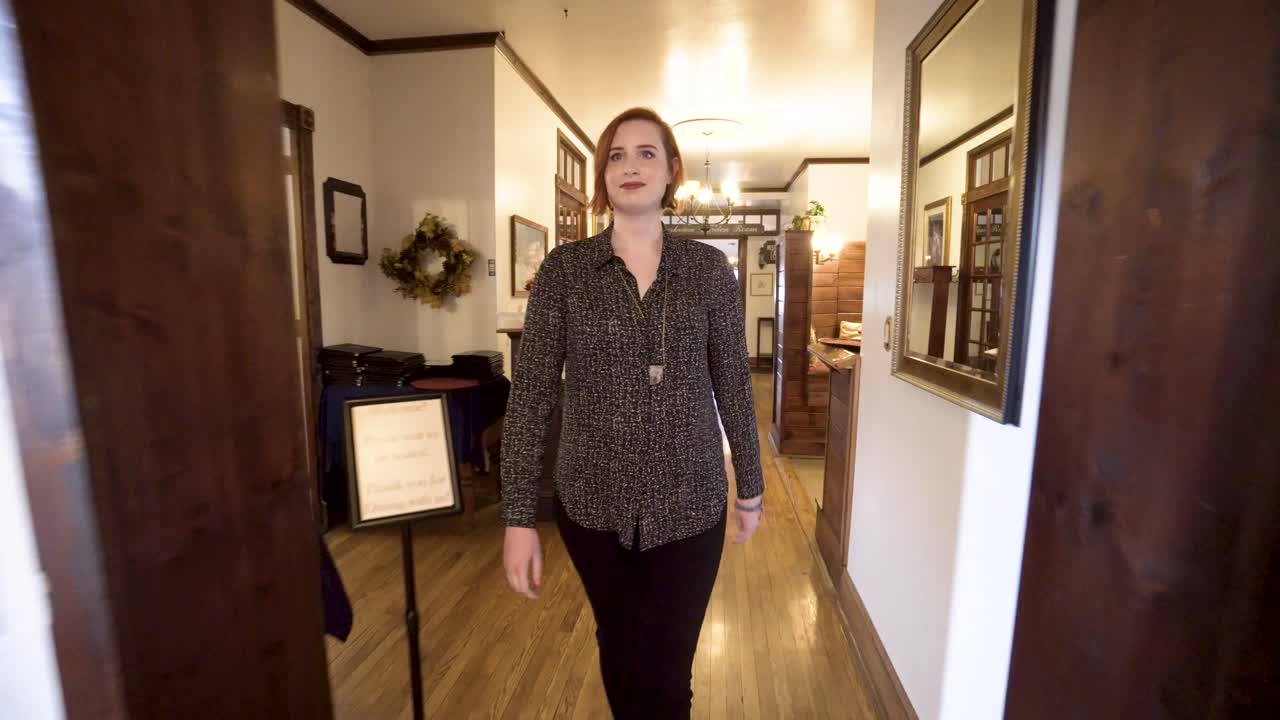 Interior hallway with a woman