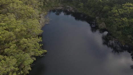 Quiet-Water-With-Reflection-At-The-Blue-Lake-On-North-Stradbroke-Island-In-Queensland,-Australia