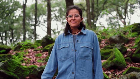 Smiling-ethnic-woman-in-eyeglasses-in-woods