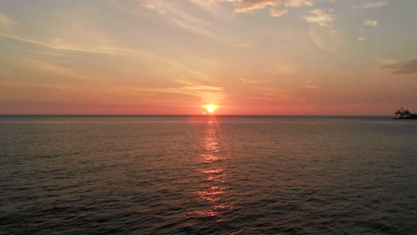 Beautiful-sunset-over-sea-in-Cambodia,-ascending-aerial-drone-view