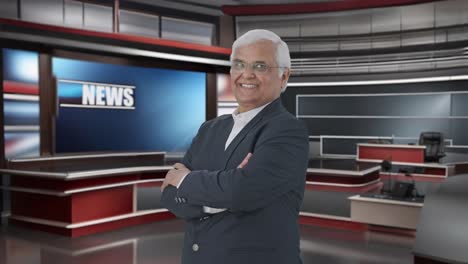 portrait of happy indian senior journalist standing crossed hands