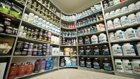 sport nutrition store interior with large choice of nutritional supplements.