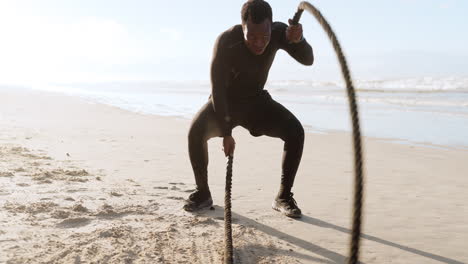 Beach,-battle-rope-and-black-man-training