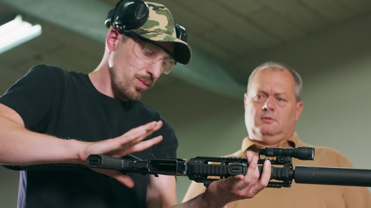 A man learns how to shoot a rifle at the shooting range