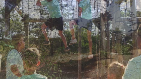 climbing rope net in sunny park, children supervised by adult outdoors