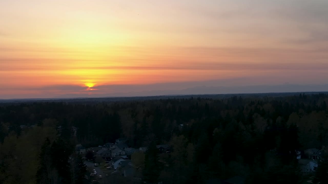 Aerial of a warm sunset in the Pacific North West.