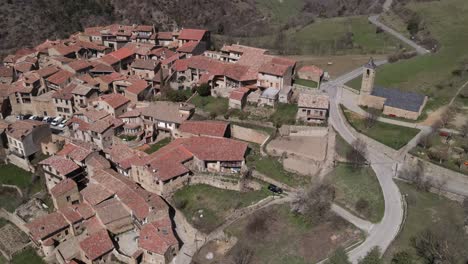Aerial-views-of-an-old-village-with-a-romanesque-church-in-the-pyrenees-in-Spain