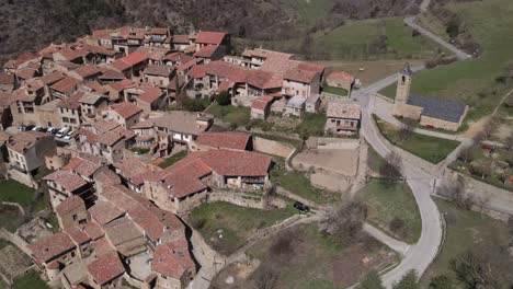 aerial views of an old village with a romanesque church in the pyrenees in spain