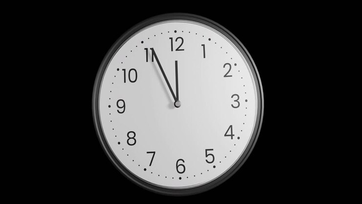 Animation of clock ticking showing midnight on black background
