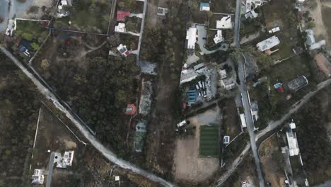 top down drone shot of monterrey, mexico's worn down streets