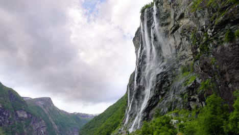 majestic waterfall cascading down a norwegian fjord