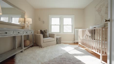 push-in-shot-of-a-nursery-with-a-lounge-chair-and-baby-crib