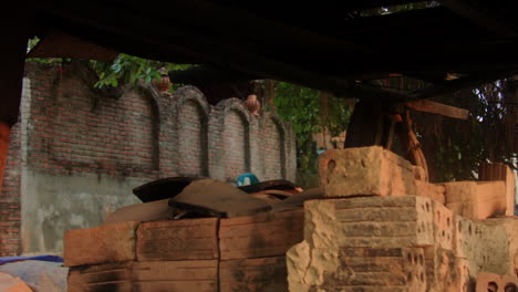 Thanh-Ha-pottery-village-in-Vietnam-showcases-traditional-brick-made-pottery-fired-in-wood-ovens,-with-visible-heat-adding-to-the-charm