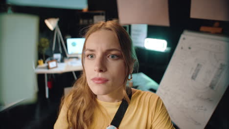 focused business woman checking information on sticker board in hipster office.