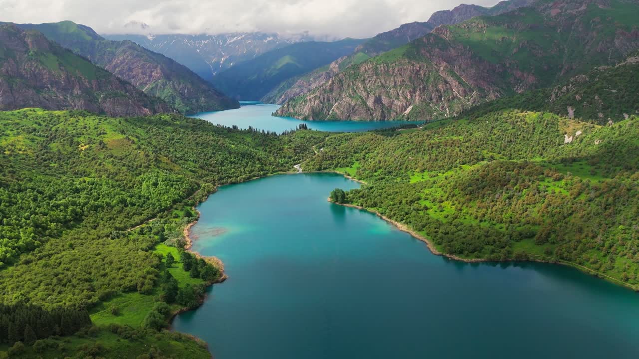 Sary-Chelek Lake, Kyrgyzstan. Surrounded by lush green forests and dramatic peaks, this UNESCO Biosphere Reserve is a pristine natural wonder in Central Asia
