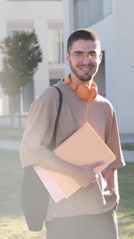 one student looking at the camera standing in the campus