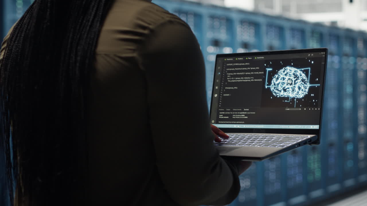 Data center engineer doing AI data analysis on laptop to upgrade infrastructure