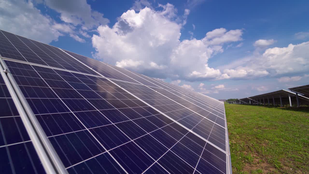 Long solar panel on field. Photovoltaic power supply system. Source of ecological renewable energy. Close-up panel.