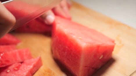 cutting watermelon into cubes