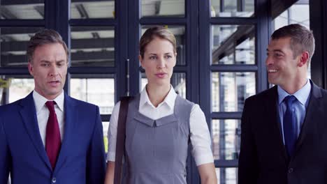 businessman and businesswoman walking together