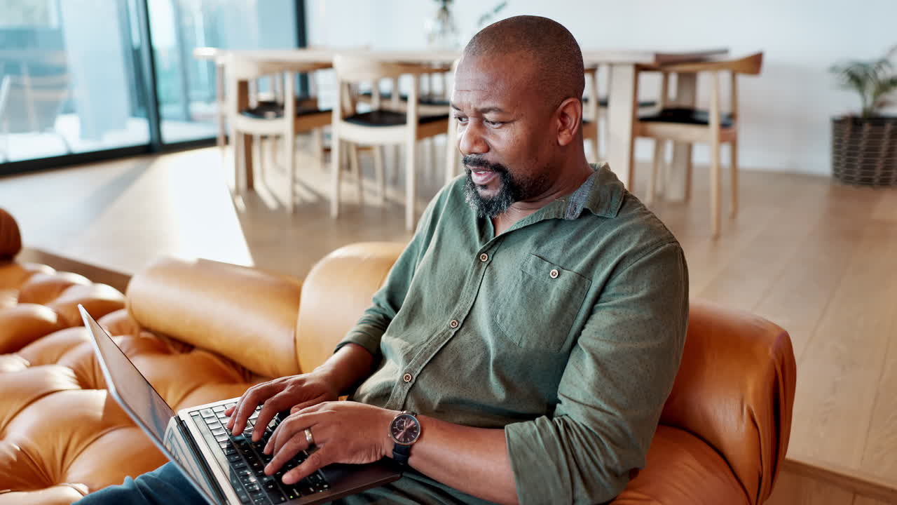 Man working on laptop at home