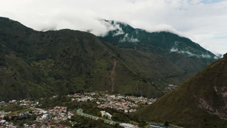 baños de agua santa townscape with sheer mountains and rainforest at tungurahua province in ecuador