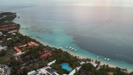 boats on the waves in azure seawater, resorts