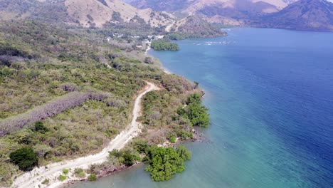 Labuan Bajo, Indonesia, Aerial reveal shot of the Island coastline and landscape.