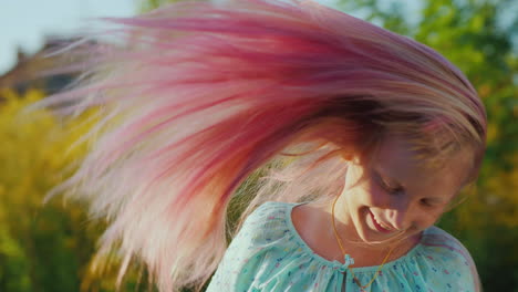 cool girl playing with her pink long hair