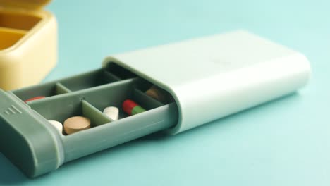 pill box with different colored pills