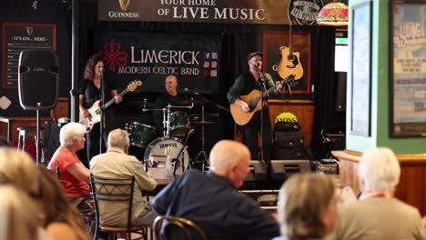 band playing music to an audience in a pub