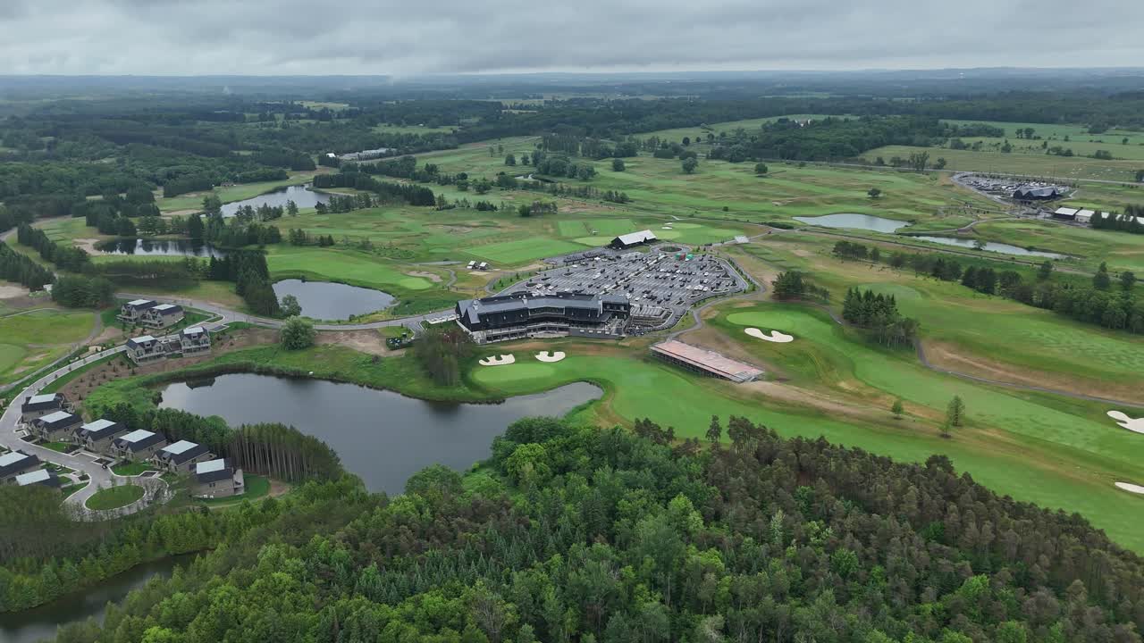 Aerial panorama of TPC Toronto at Osprey Valley showcasing rolling fairways, lakes, tree lines and the main clubhouse complex during an overcast day at this premier Canadian golf destination