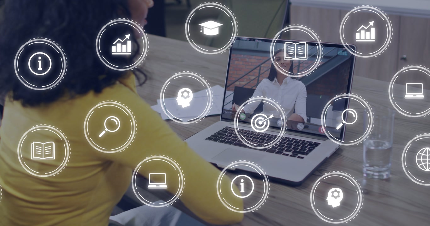 Seated woman watching laptop while remote host presenting, causing business icons moving over frame