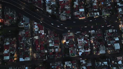 drone descends over a residential area in ecatepec as night falls