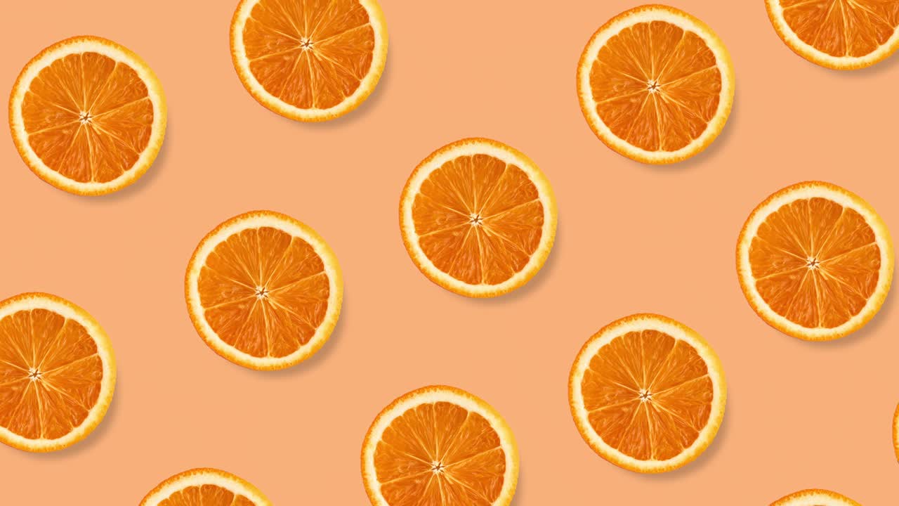 muchas rebanadas de naranja reales animadas en un fondo pastel