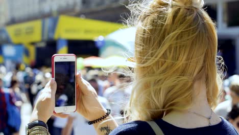 young girl shoot crowd of fans at the street during champions league