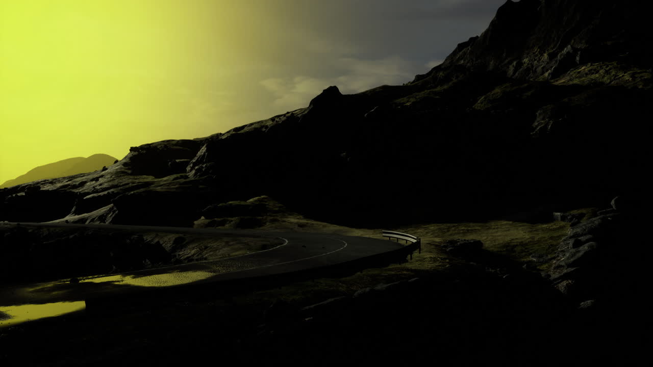 Mysterious winding road illuminated by an eerie yellow light at dusk