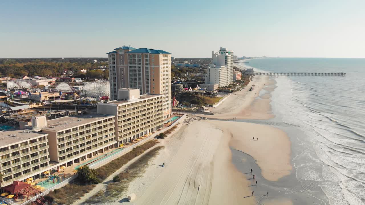 Top view of the pristine beaches of Myrtle Beach showing seaside town filled with colorful resorts and hotels