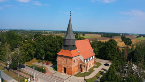 aerial shot, top view of beautiful medieval church in cedry wielkie, poland