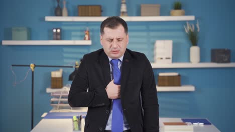 sick businessman with health problems coughing while working in office.