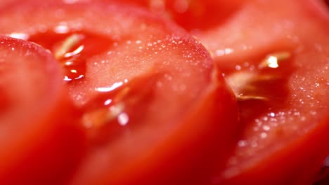 slices of fresh tomato rotate slowly.