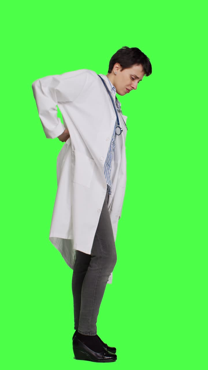 Profile Woman physician experiencing lower back acute pain in studio